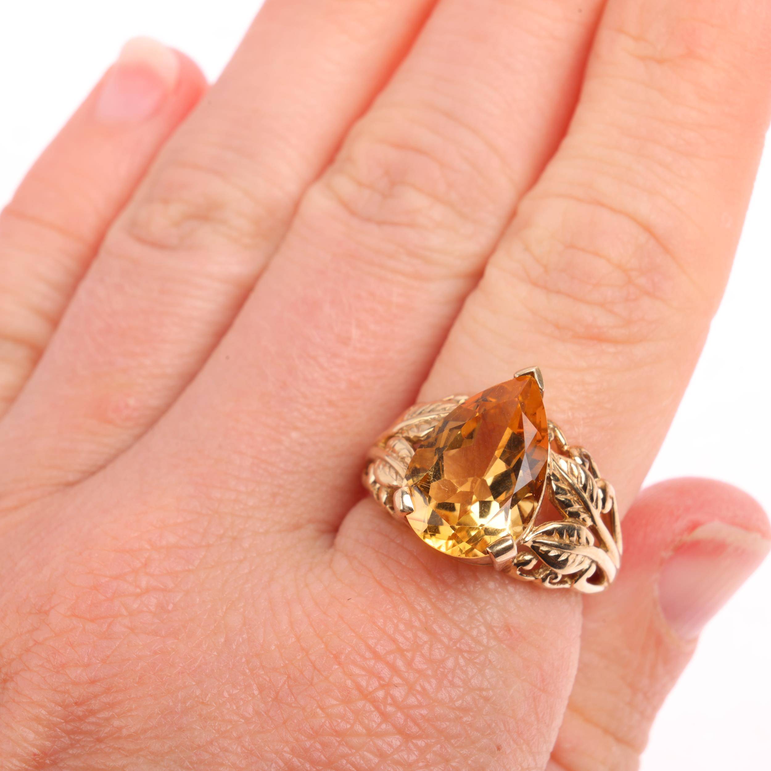 A 9ct gold citrine dress ring, maker GTV, Birmingham 2005, set with pear-cut citrine and floral - Image 4 of 4