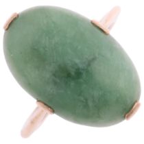 A late 20th century jadeite panel ring, claw set with oval cabochon jadeite, apparently unmarked,