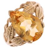 A 9ct gold citrine dress ring, maker GTV, Birmingham 2005, set with pear-cut citrine and floral