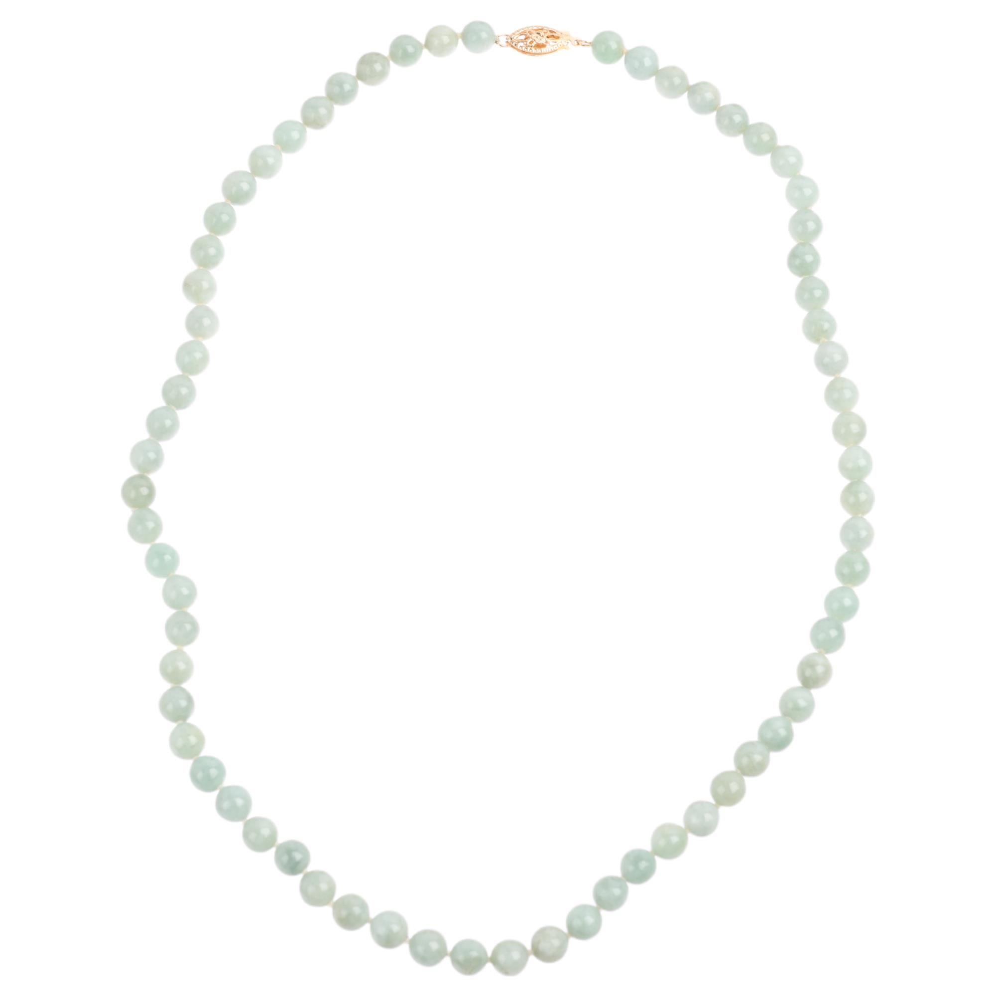 A single-row polished jade bead necklace, with 14ct gold clasp, beads measure 6.1mm, 44cm, 27.3g