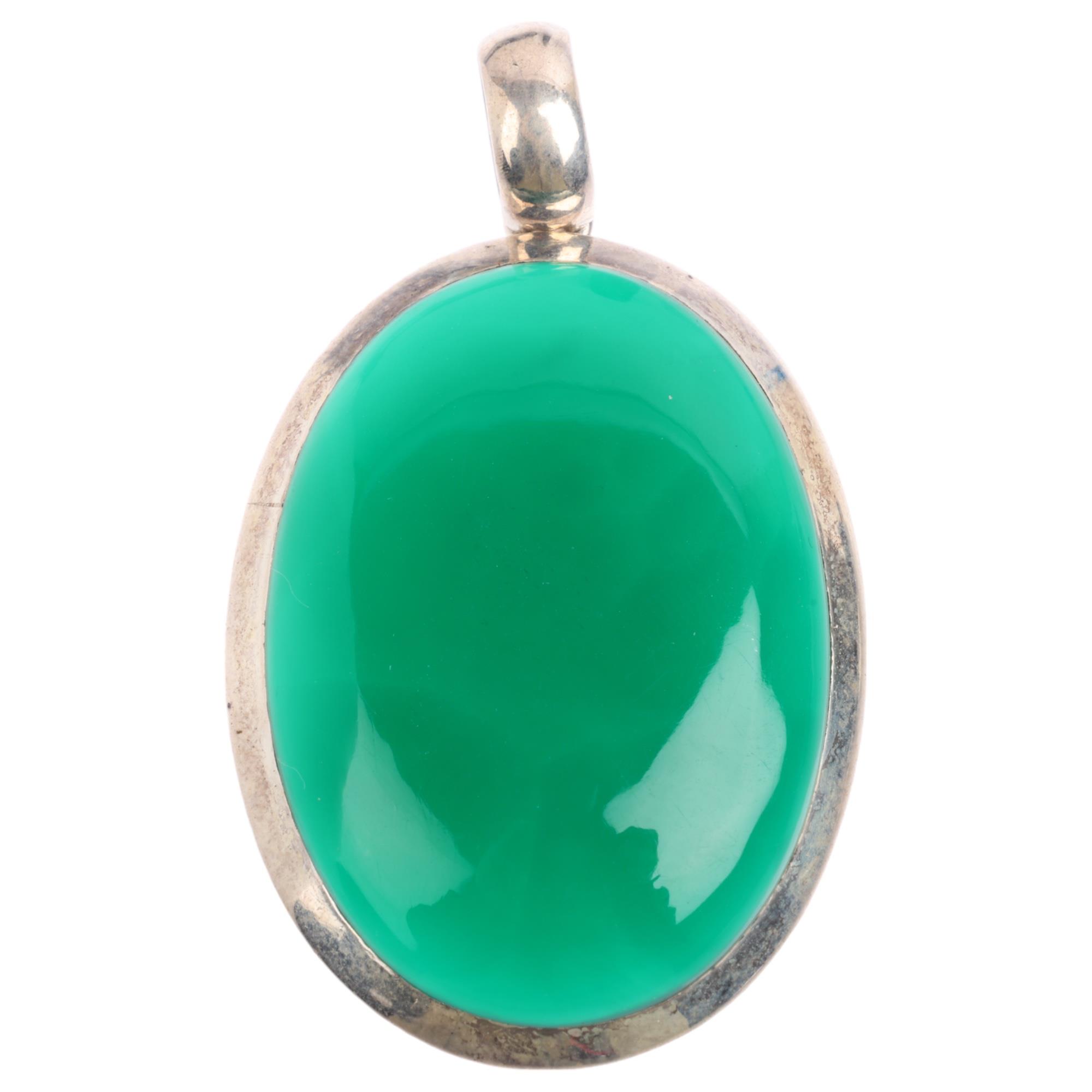 A large silver chalcedony pendant, set with oval cabochon chalcedony, 50.4mm, 17.2g Condition