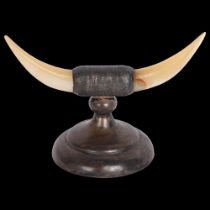 An Edwardian novelty silver and mother-of-pearl Highland cattle horns knife rest, GE Walton,