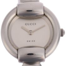 GUCCI - a lady's stainless steel 1400L quartz bangle watch, serial no. 0188862, case width 25mm,