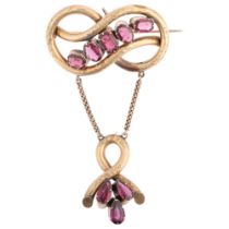 A large Victorian garnet knot drop brooch, circa 1860, set with vari-cut garnets, apparently