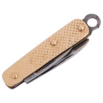 A 9ct gold miniature penknife, maker FM, London 1965, 29.6mm, 3.2g gross Condition Report: No damage