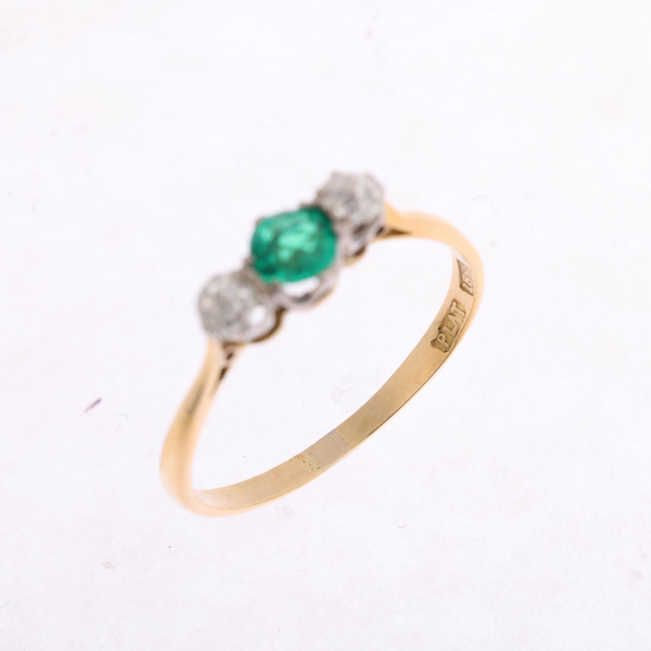 An Art Deco 18ct gold three stone emerald and diamond ring, platinum-topped set with round-cut - Image 3 of 4