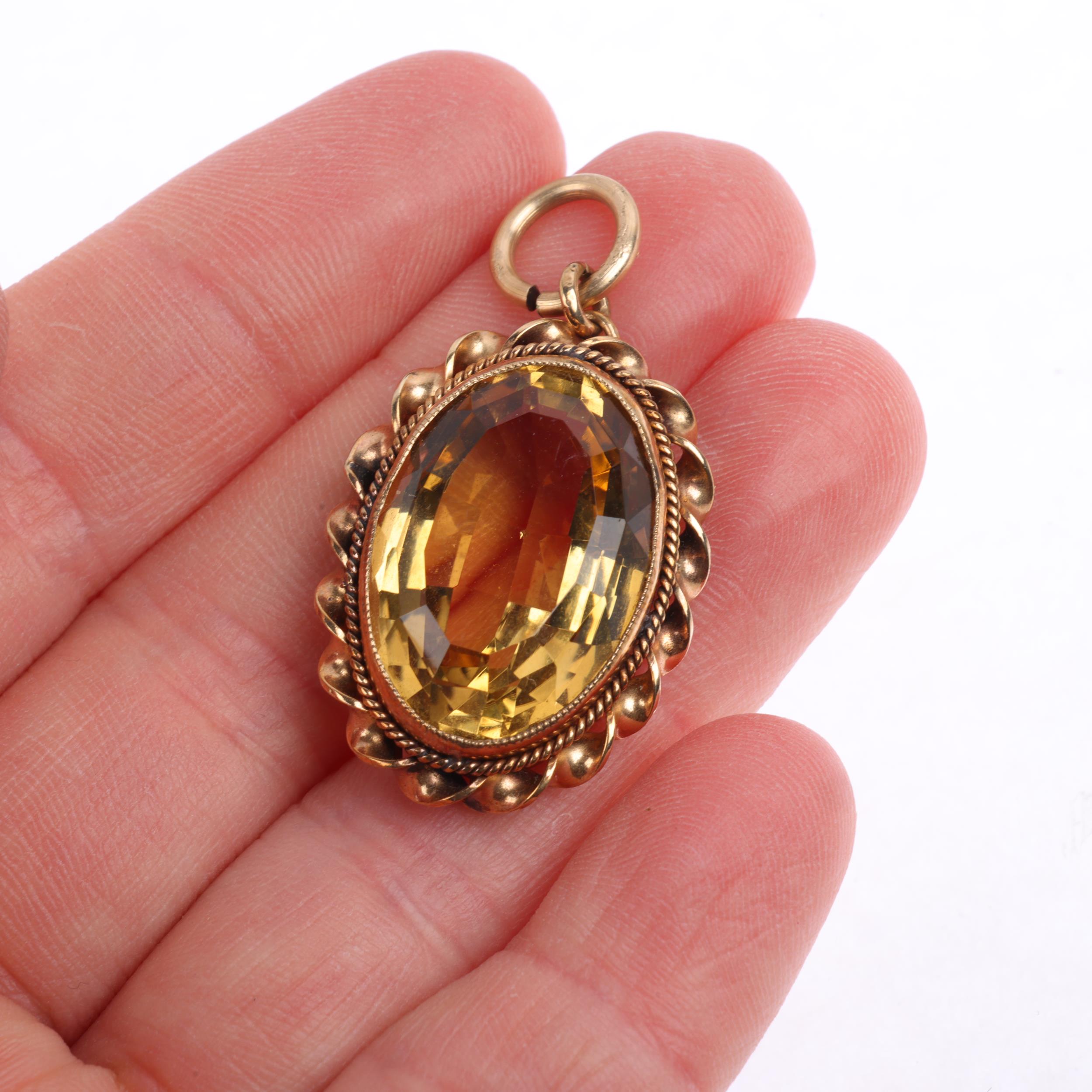 A 9ct gold citrine pendant, maker DJE, Edinburgh 1962, rub-over set with oval step-cut citrine - Image 4 of 4