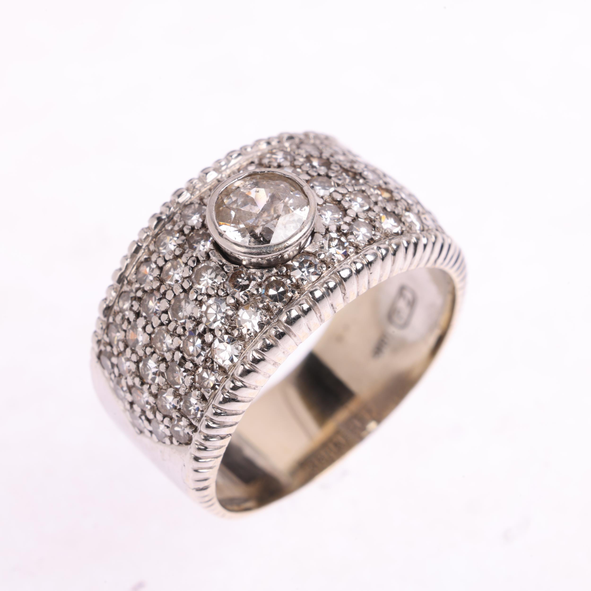 A large 18ct white gold diamond band ring, maker ZJ, import London 1978, rub-over and pave set - Image 2 of 4