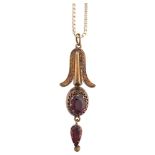 A Victorian Etruscan Revival garnet pendant necklace, circa 1880, set with oval and pear-cut