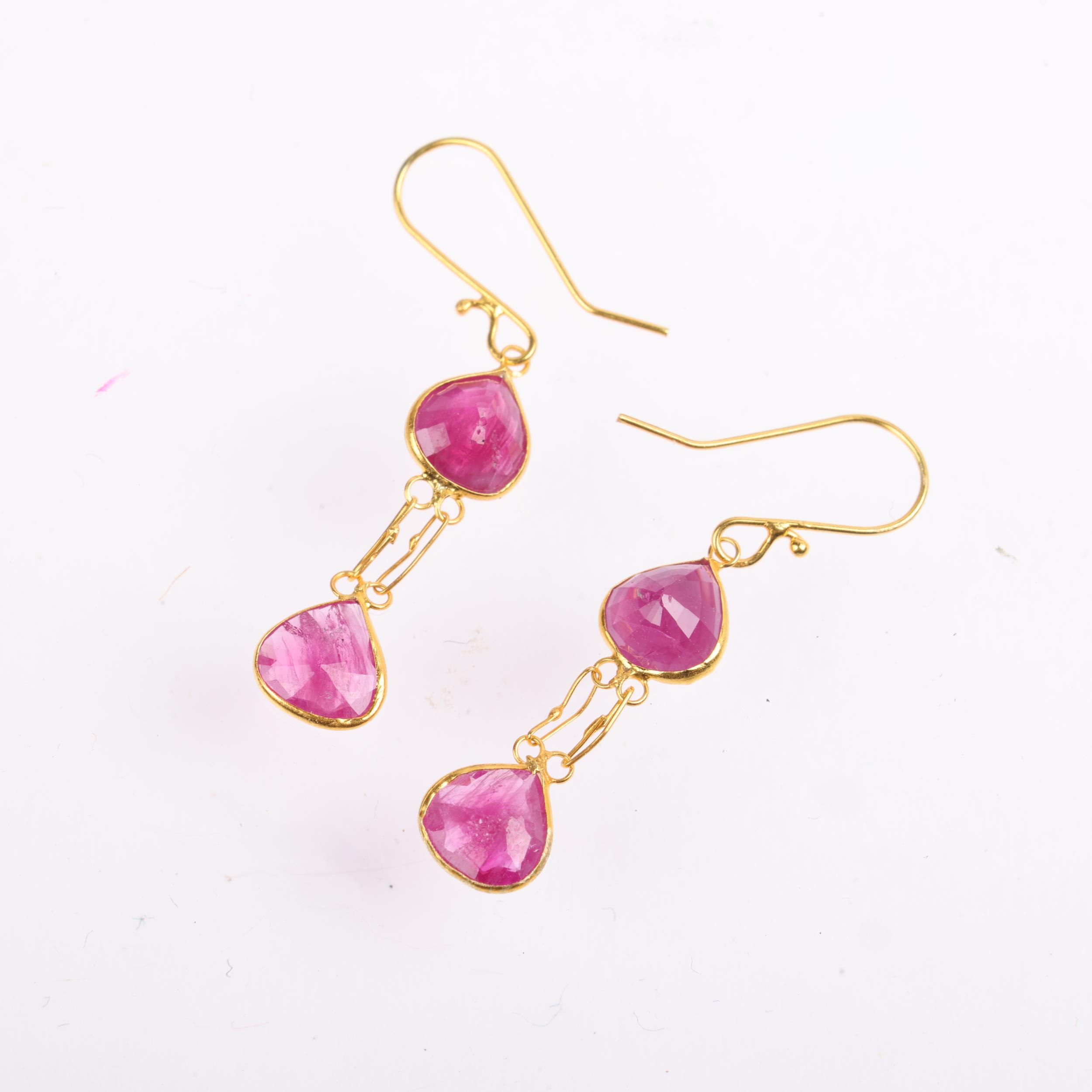 A pair of 18ct gold ruby drop earrings, set with pear-cut rubies, and shepherd hook fittings, 27. - Image 2 of 4