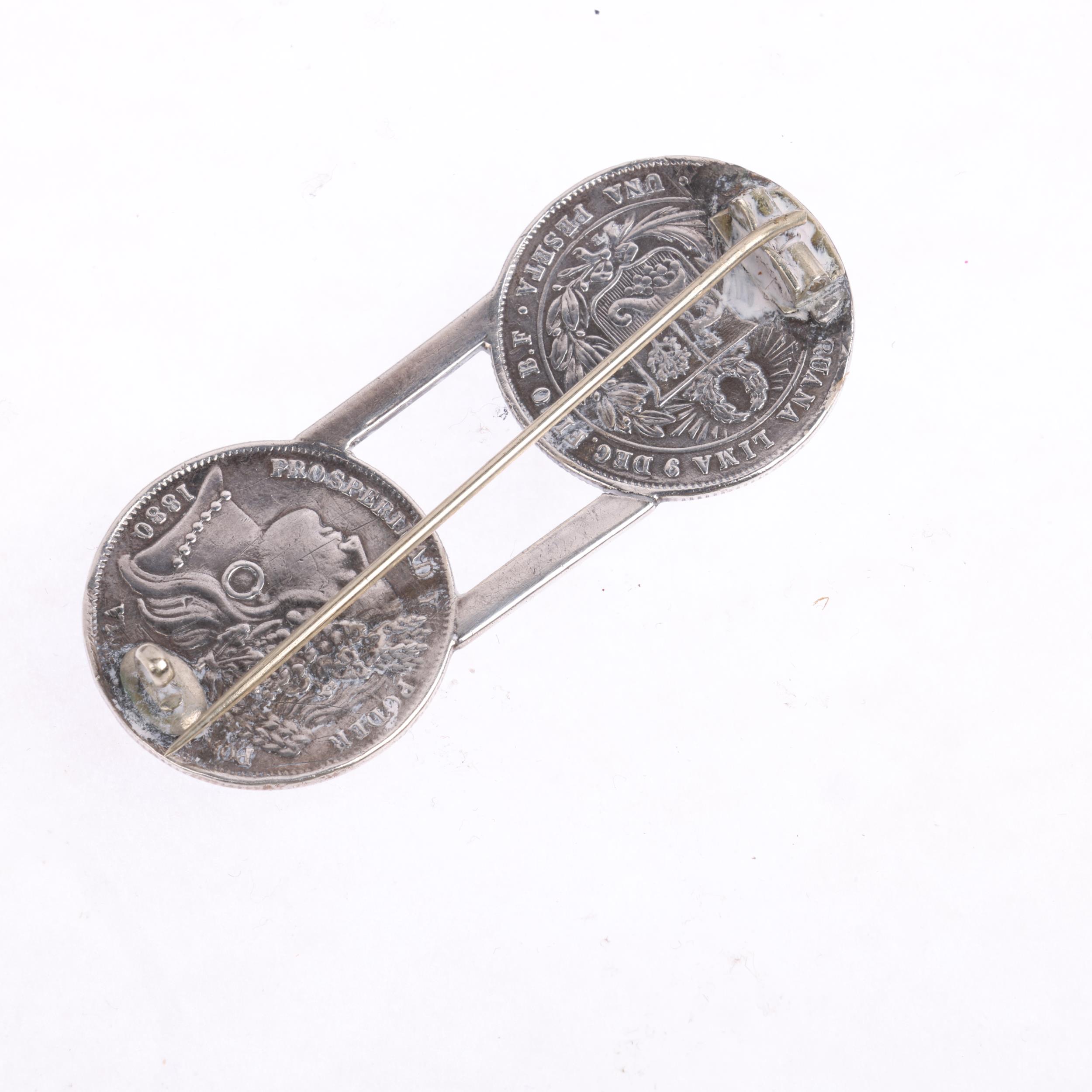 A 19th century Peruvian Civil War Period silver and enamel coin brooch, Una Peseta, 1880, 54.5mm, - Image 3 of 3