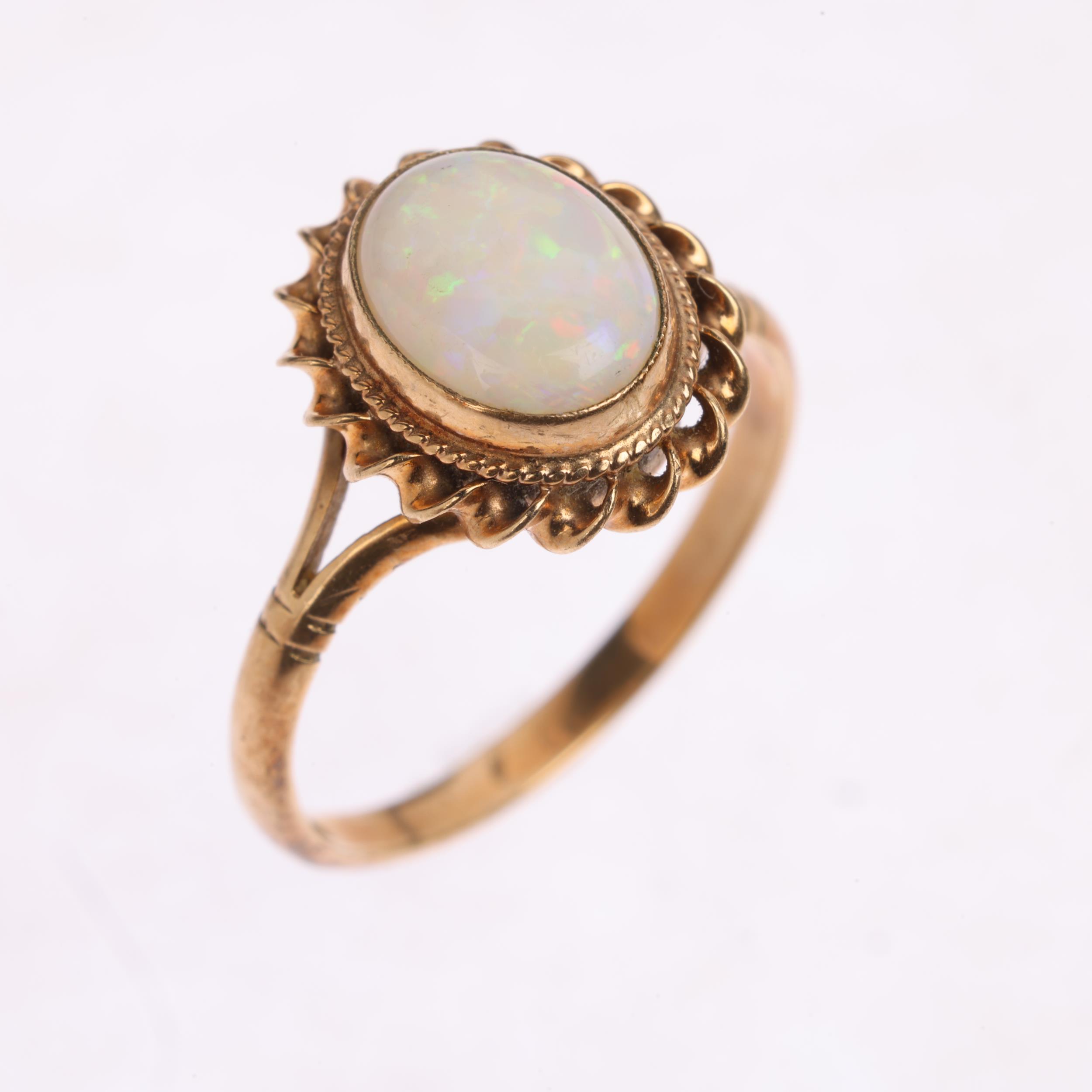 A 9ct gold solitaire opal dress ring, maker CG&S, Birmingham 1986, rub-over set with oval cabochon - Image 2 of 4