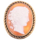 A Victorian shell bacchante cameo brooch, relief carved depicting female profile, in unmarked yellow