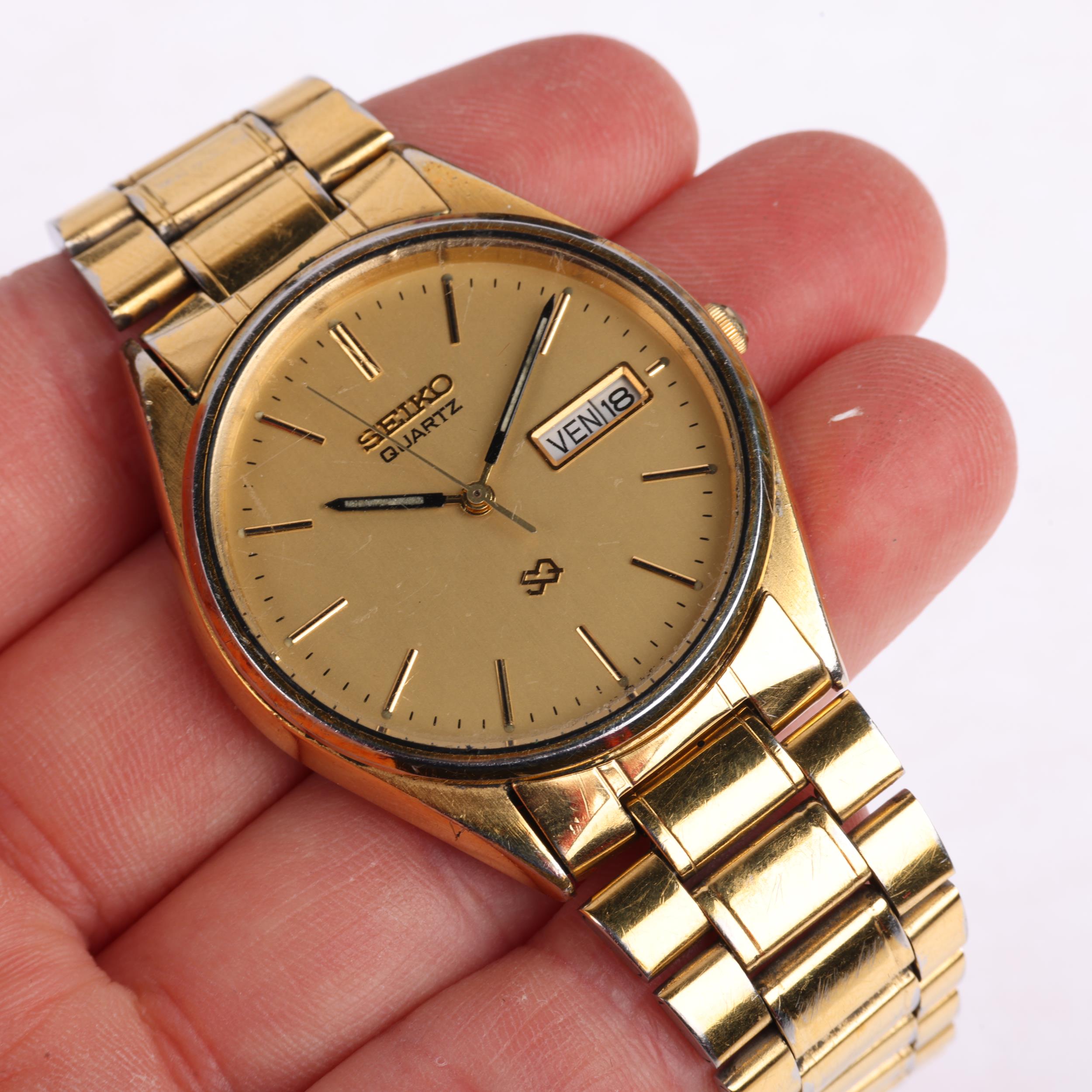 SEIKO - a gold plated stainless steel SQ quartz bracelet watch, ref. 5H23-8A00, champagne dial - Image 5 of 5