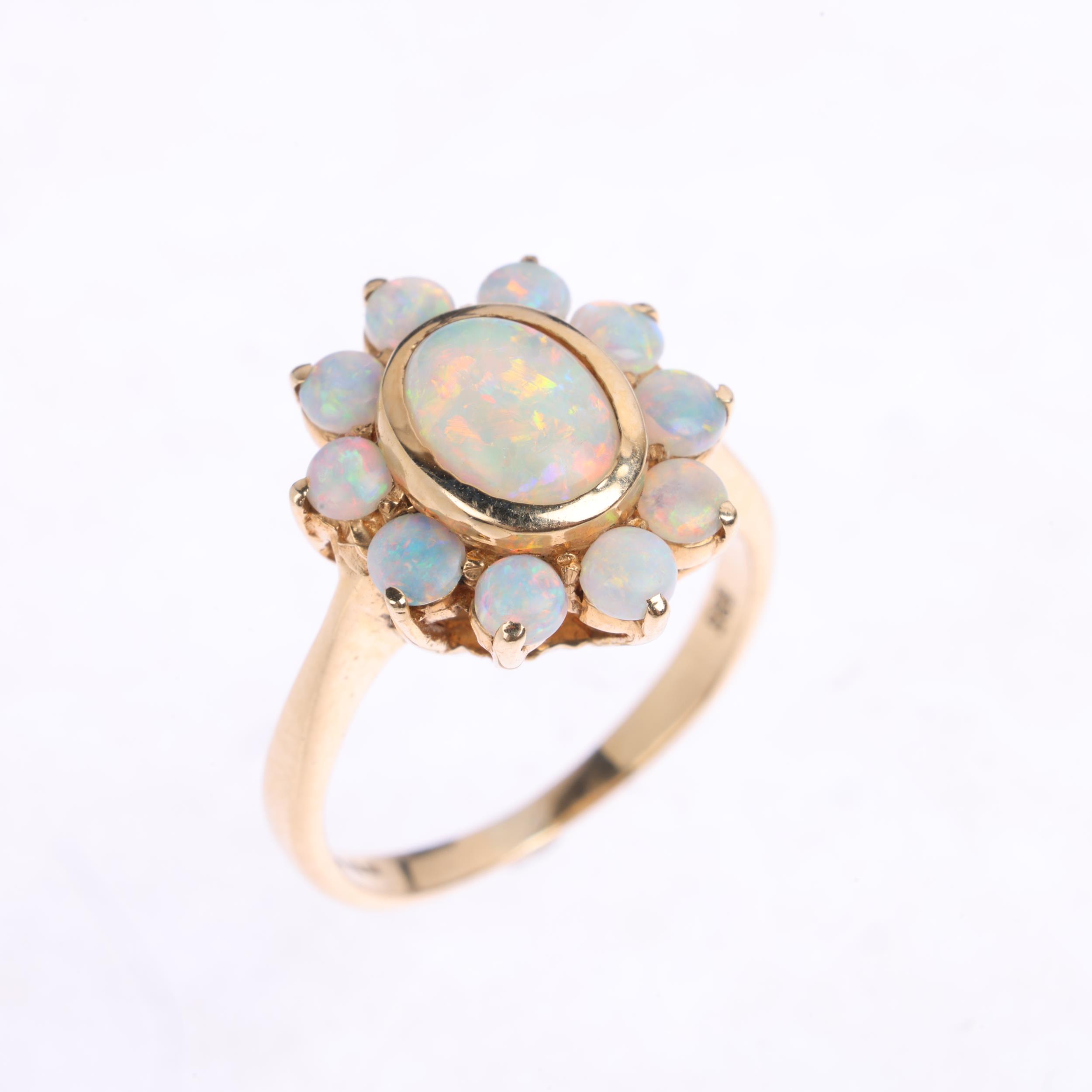 A 14ct gold opal flowerhead cluster ring, set with oval and round cabochon opals, setting height - Image 2 of 4