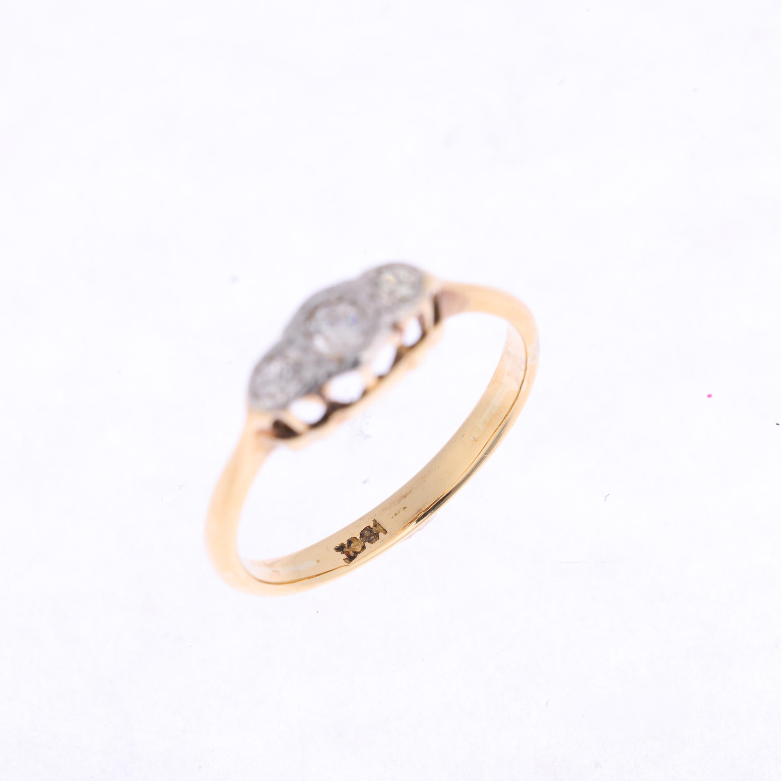 An 18ct gold three stone diamond ring, platinum-topped set with round brilliant-cut diamonds, - Image 3 of 4