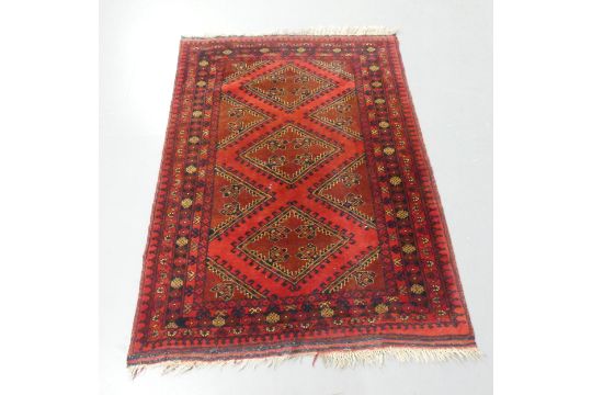 A red-ground Baluchi rug. 143x105cm. - Image 1 of 2