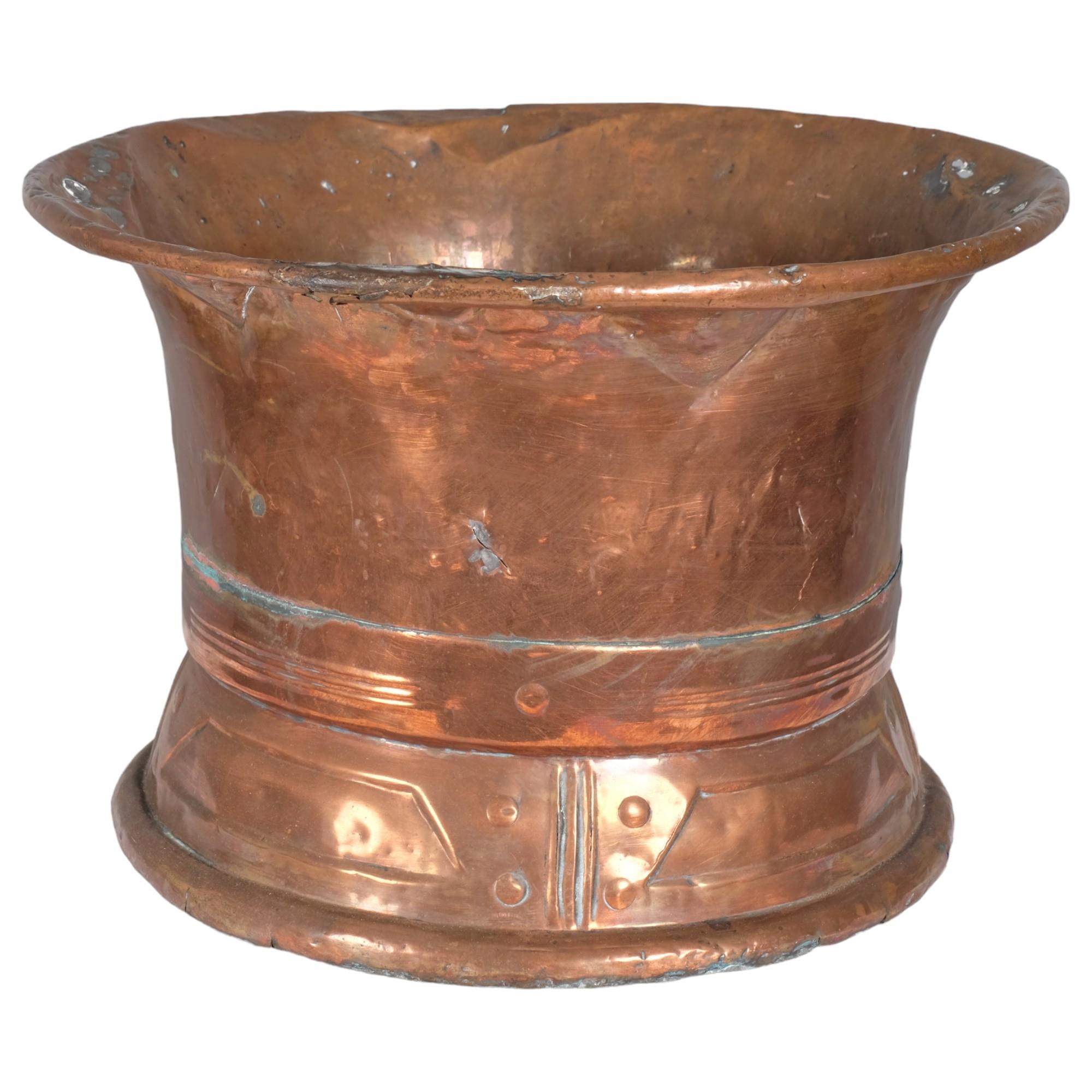 An Arts & Crafts style spun copper flared rim bowl. 42x28cm. Some dents and signs of wear. No