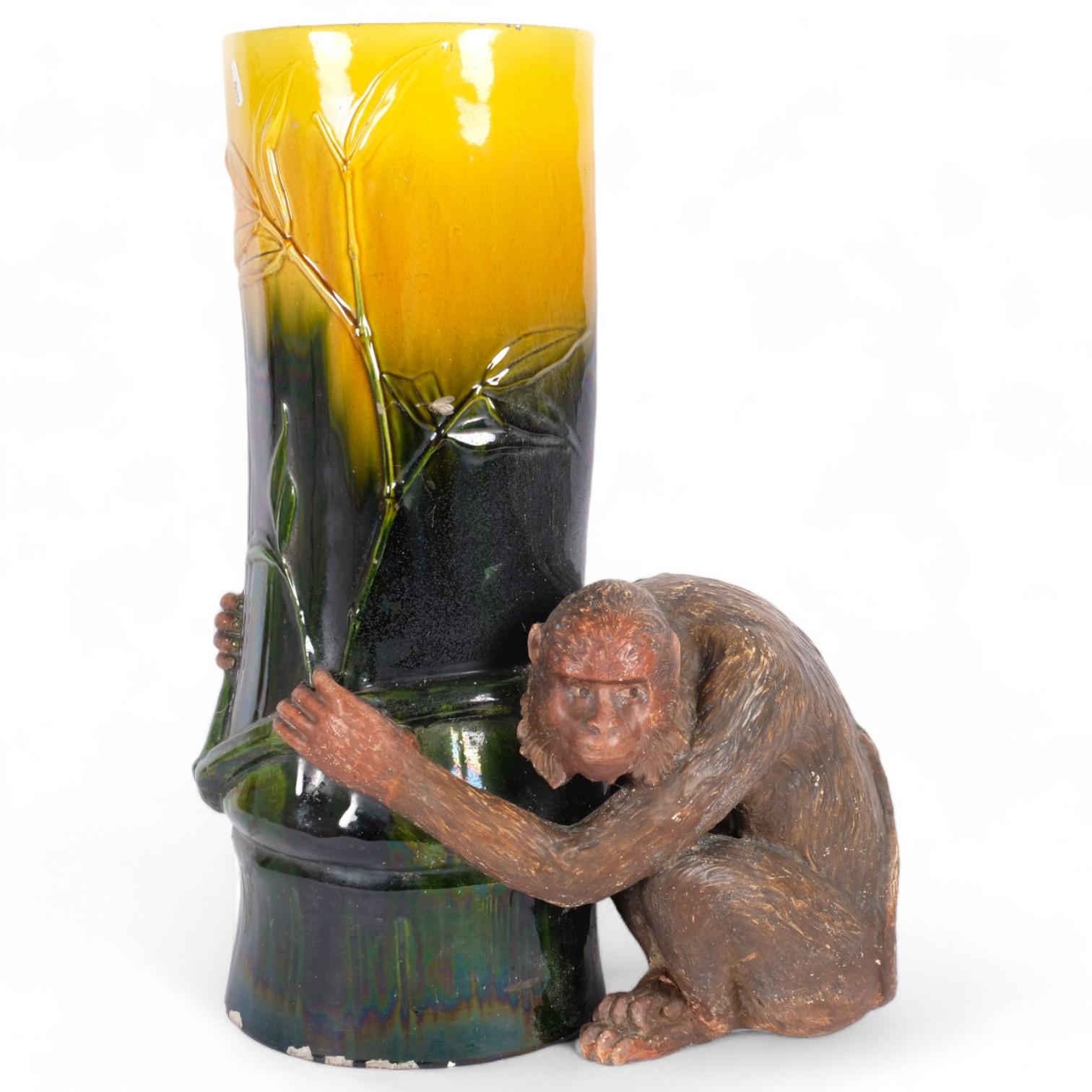 A large Majolica Bretby pottery monkey umbrella stand, in the form of a monkey holding a tree