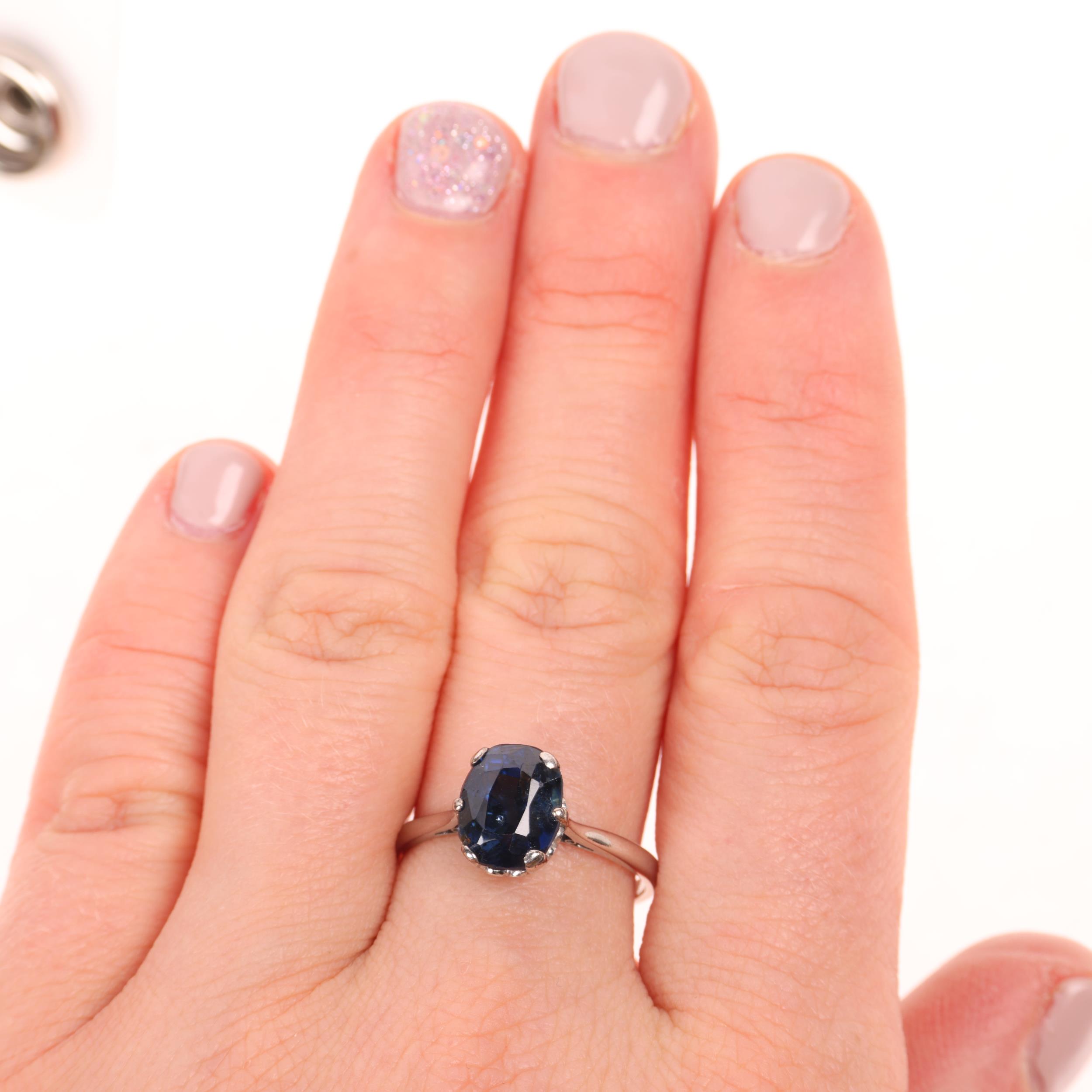 A platinum single stone sapphire ring, claw set with 3.75ct oval mixed-cut sapphire, sapphire weight - Image 3 of 3