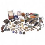 A tray of various items, including a Texas Rangers baseball, pocket knives, brass Vesta case,