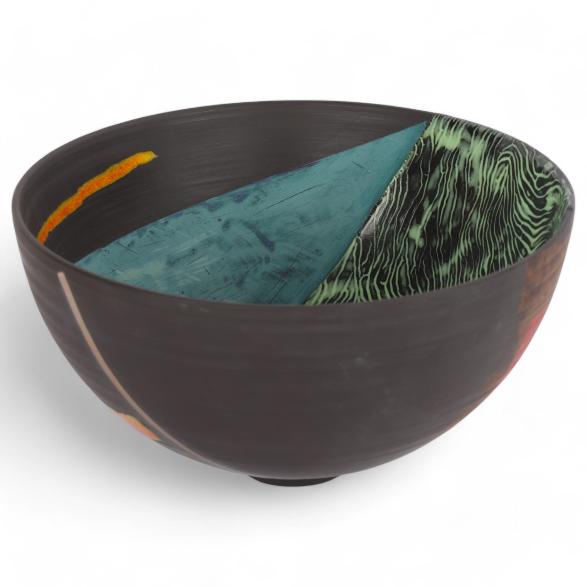 TONY LAVERICK (b.1961), a black porcelain studio pottery bowl, with coloured and lustre glazes,