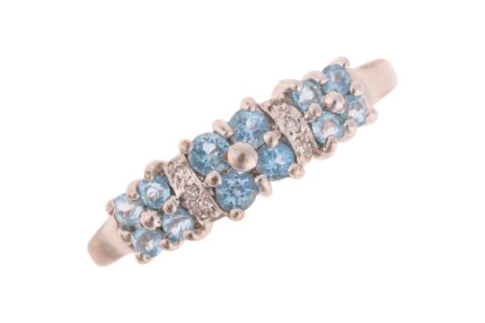 A 9ct white gold blue topaz and diamond dress ring, set with round-cut topaz and single-cut - Image 1 of 3