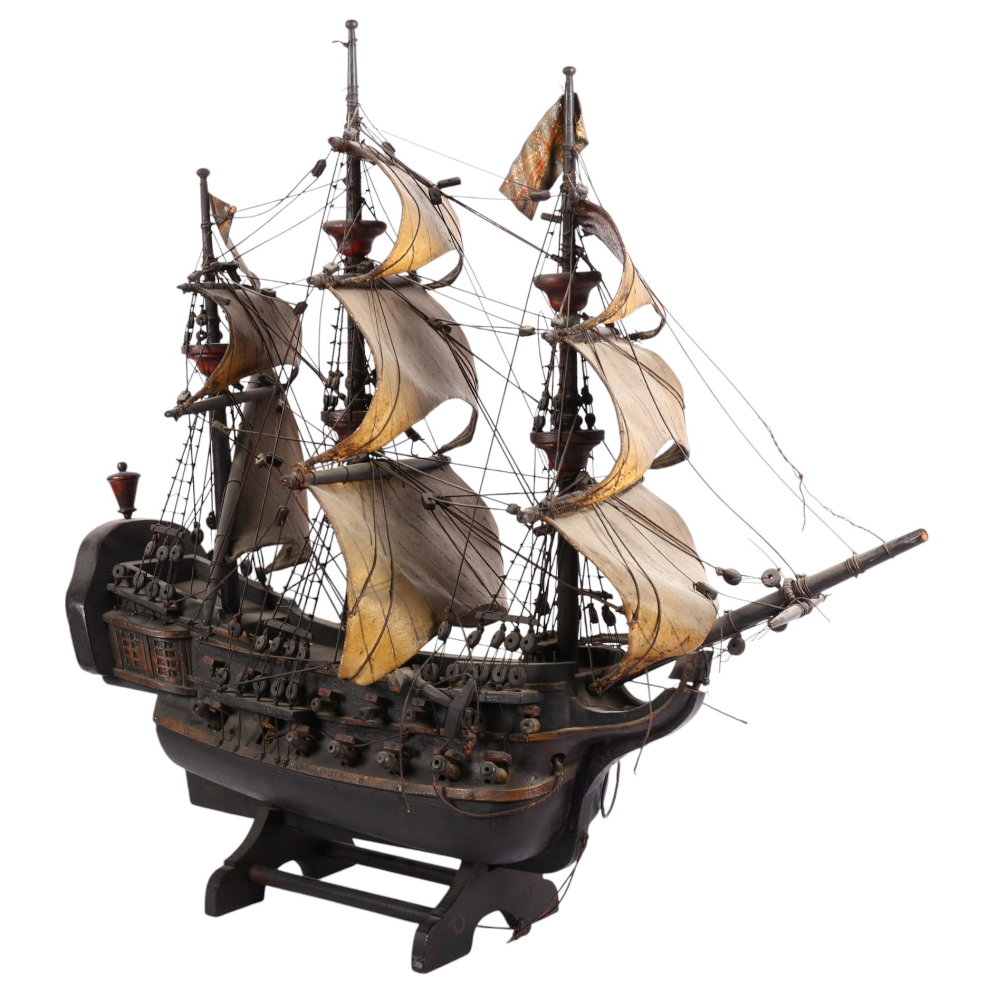 A scratch-built wooden galleon ship, with 3 masts, and associated wooden stand, L68cm, H68cm