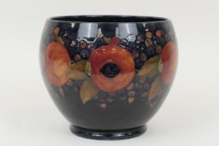 William Moorcroft Pomegranate jardiniere, baluster form with a wide neck, decorated with a deep blue