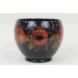 William Moorcroft Pomegranate jardiniere, baluster form with a wide neck, decorated with a deep blue