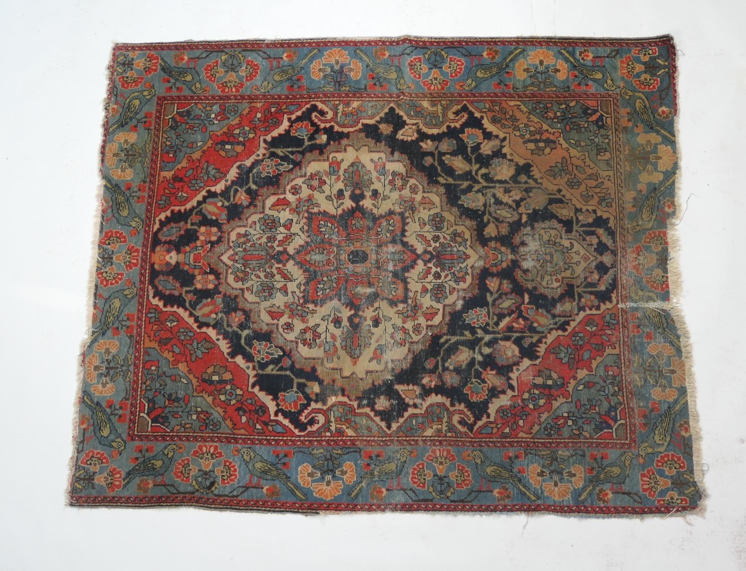 Persian Malayer woollen rug, late 19th Century, centred with a red flowerhead motif within a fawn