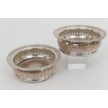 Pair of silver plated wine coasters, 19th Century, turned wooden base, 14.5cm diameter (Please