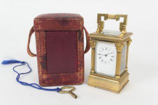 French brass miniature carriage timepiece, circa 1900-20, with keyed carrying handle, Corinthian