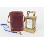 French brass miniature carriage timepiece, circa 1900-20, with keyed carrying handle, Corinthian