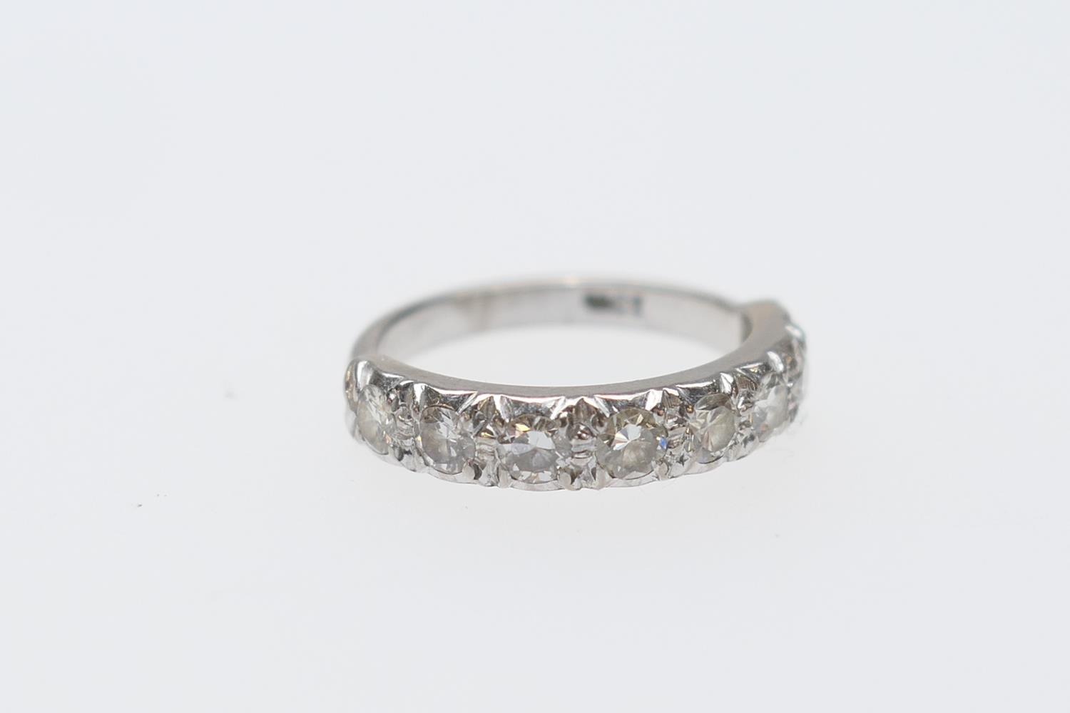 Diamond half eternity ring in 18ct white gold, set with eight round brilliant cut diamonds totalling