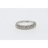 Diamond half eternity ring in 18ct white gold, set with eight round brilliant cut diamonds totalling