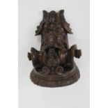 Late 17th Century carved oak bracket, carved with a grotesque mask and paper scroll, 22cm x 16.