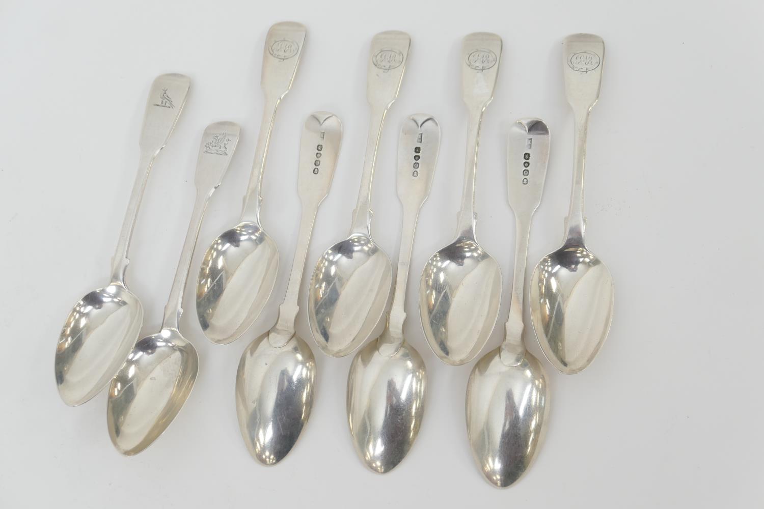 Seven George IV silver fiddle pattern dessert spoons, maker W B, London 1829; and two further silver