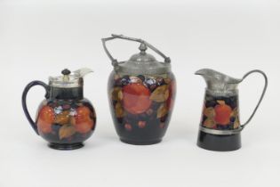 William Moorcroft Pomegranate biscuit barrel, with hammered pewter mounts and lid, swing handle,