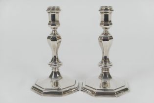 Pair of Elizabeth II cast silver candlesticks, in Queen Anne style, maker B S, London 1979, inverted