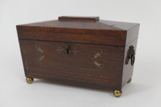 Regency rosewood and brass inlaid sarcophagus tea caddy, circa 1820, with lion's mask ring