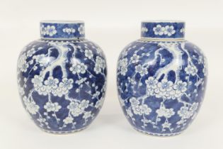 Pair of Chinese blue and white prunus pattern lidded ginger jars, 19th Century, each with blue