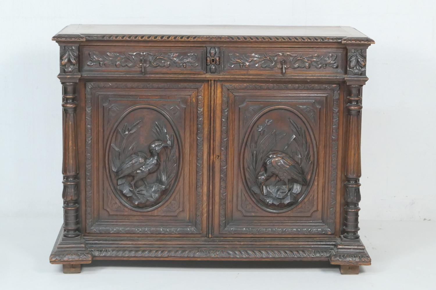 Flemish carved oak side cabinet, late 19th Century, fitted with oak leaf carved frieze drawers