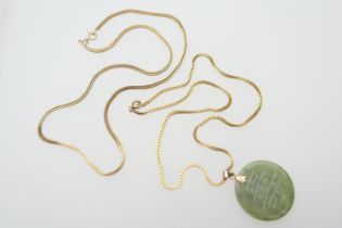Hong Kong jadeite pendant, acid etched with Shou character, with 14ct gold loop for suspension, 50mm