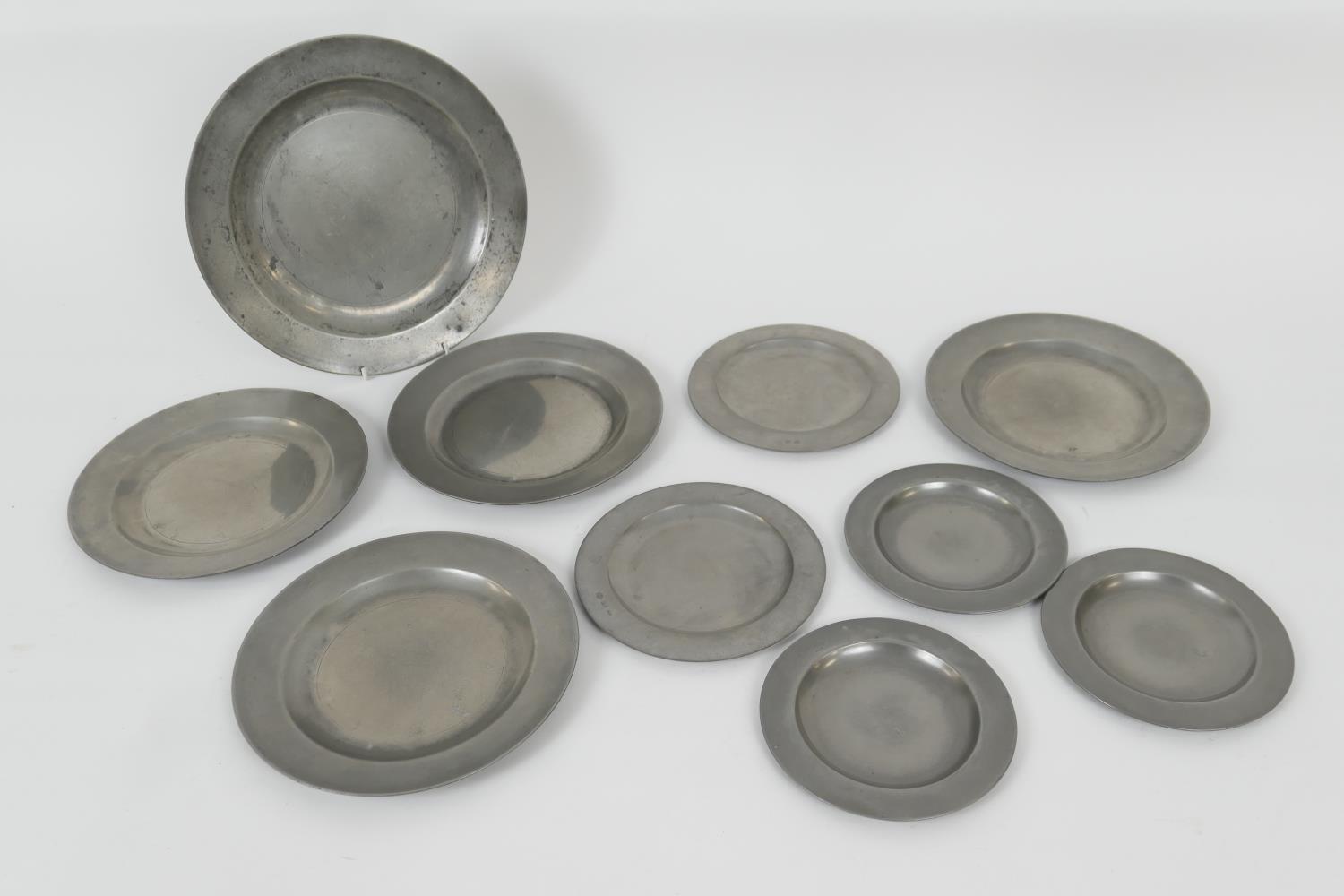 Number of pewter plates of varying size, 18th and 19th Century, the largest 30.5cm, four of 24.