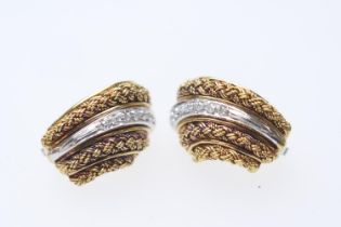 Pair of 18ct two colour gold and diamond earrings, each of shell form set with seven small round cut