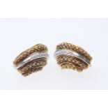 Pair of 18ct two colour gold and diamond earrings, each of shell form set with seven small round cut