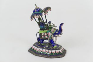 Indian Benares enamelled white metal elephant, early 20th Century, traditional form with caparisoned