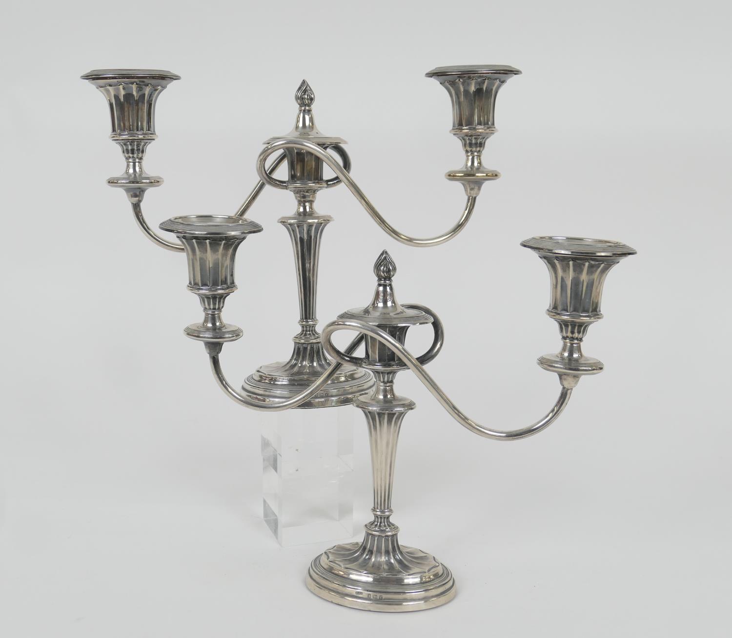 Pair of Edwardian silver candelabra, Birmingham 1906, in the Adam style, having two S-shaped