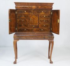 Queen Anne style walnut cabinet on stand, having a moulded cornice with barrel fronted frieze drawer